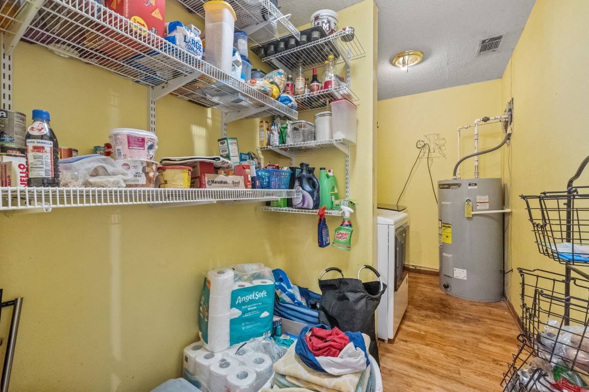 71 Shady Oaks Point Blank, TX 77364 - Photo 21 of 32 a room with lots of clutter and wooden floor