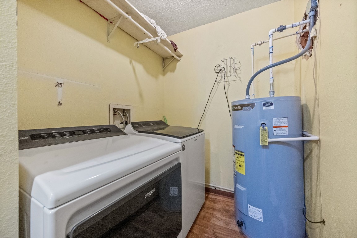71 Shady Oaks Point Blank, TX 77364 - Photo 22 of 32 a utility room with dryer and washer