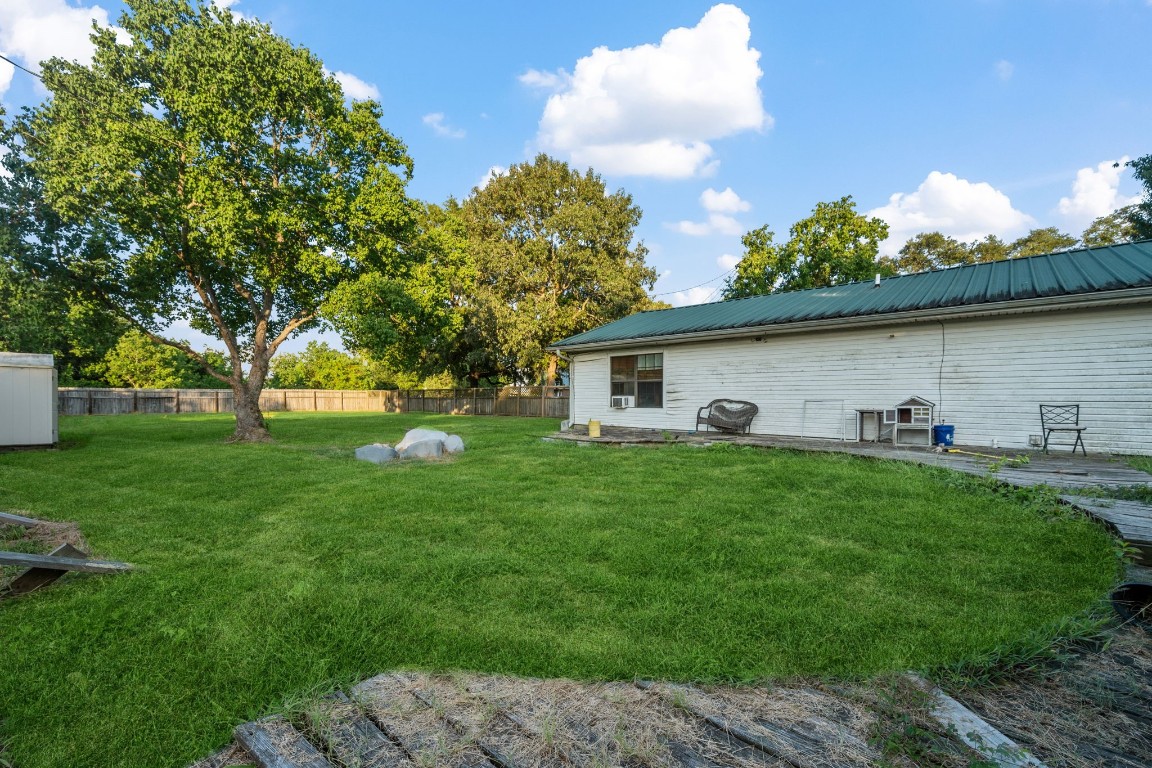 71 Shady Oaks Point Blank, TX 77364 - Photo 24 of 32 a front view of a house with garden and trees