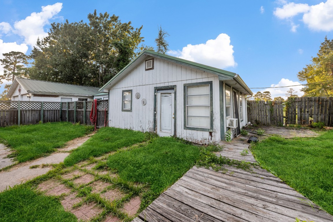 71 Shady Oaks Point Blank, TX 77364 - Photo 26 of 32 a view of a house with a yard