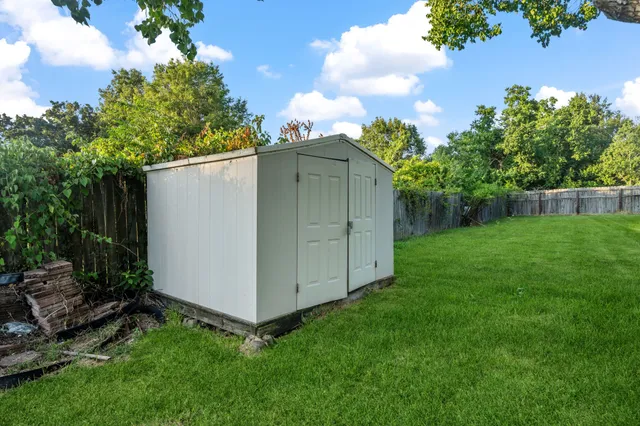 a backyard of a house with lots of green space
