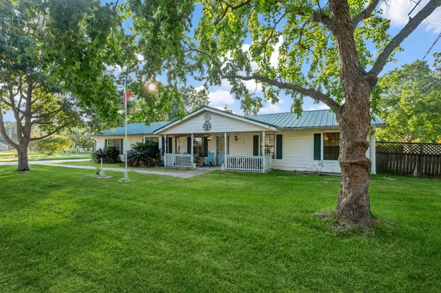 a front of a house with a garden