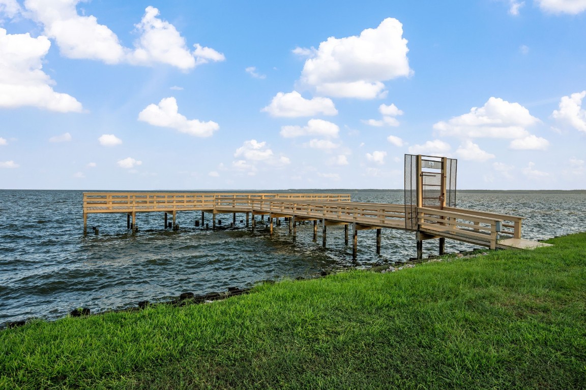 71 Shady Oaks Point Blank, TX 77364 - Photo 31 of 32 a view of a lake with a big yard