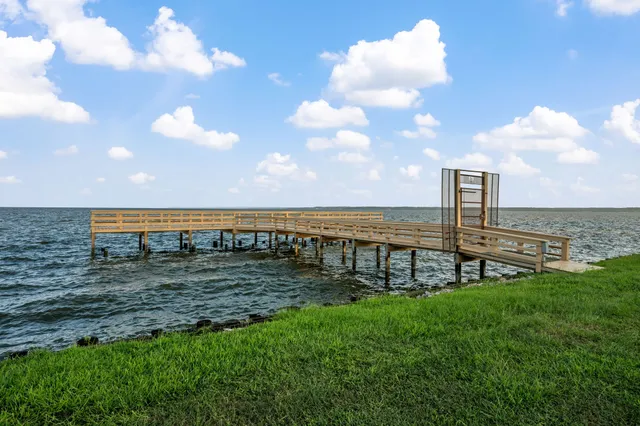 a view of a lake with a big yard