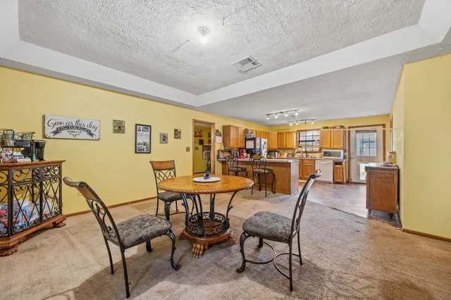 a dining room with furniture and a table