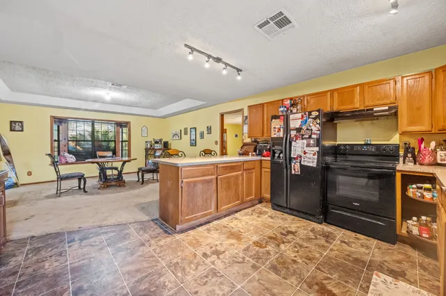 a view of a kitchen with furniture and window
