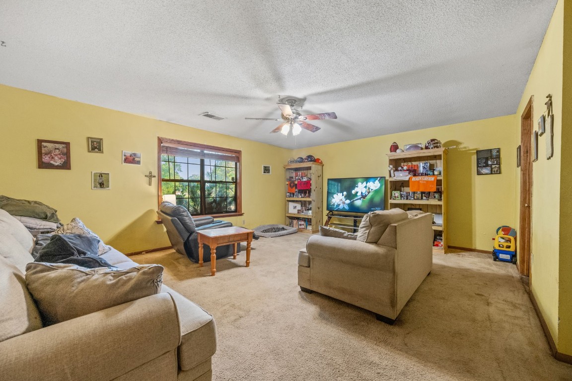 71 Shady Oaks Point Blank, TX 77364 - Photo 10 of 32 a living room with furniture and a flat screen tv