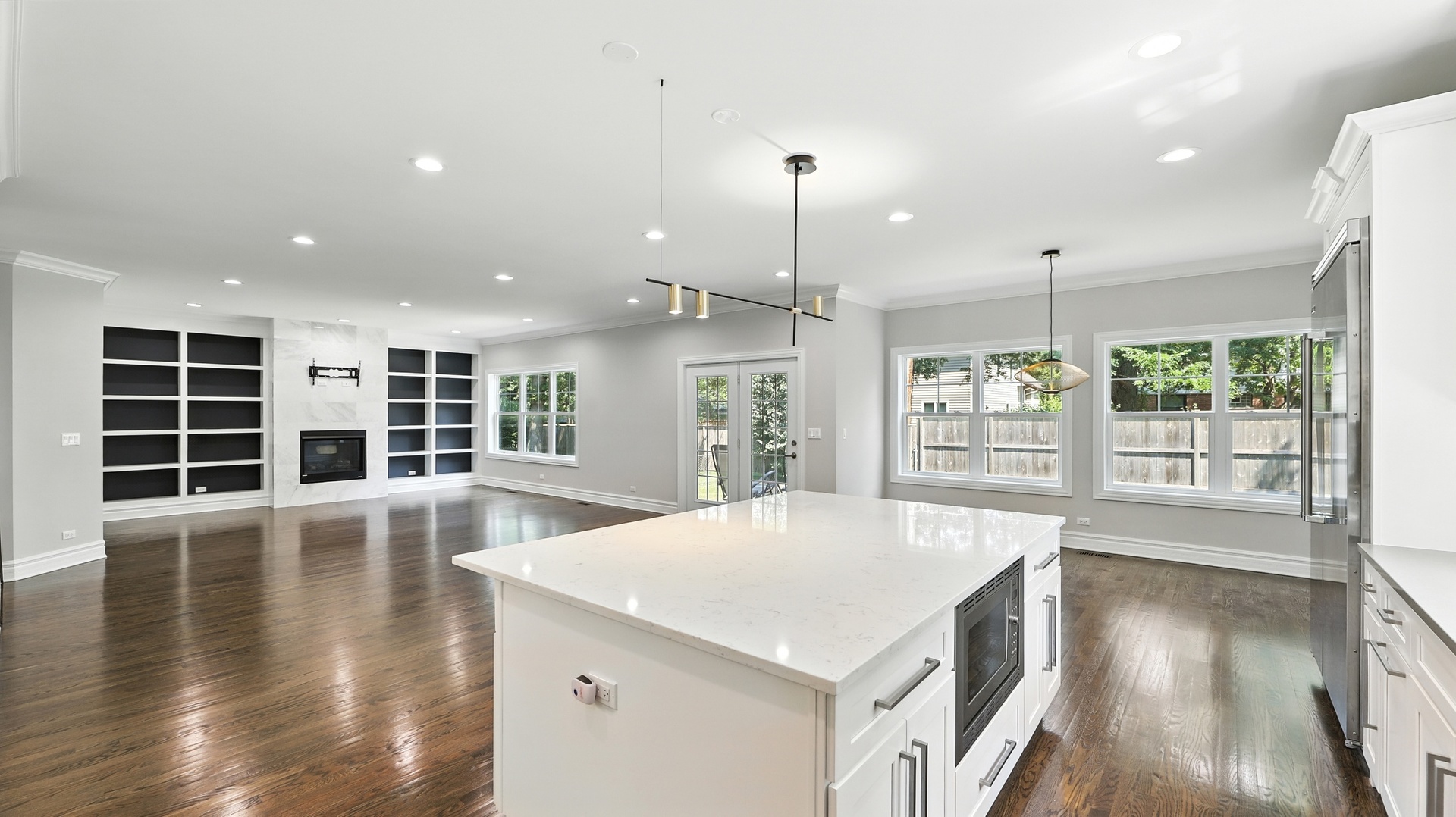1127 Kenton Road Deerfield, IL 60015 - Photo 12 of 35 a view of an empty room with wooden floor and a window