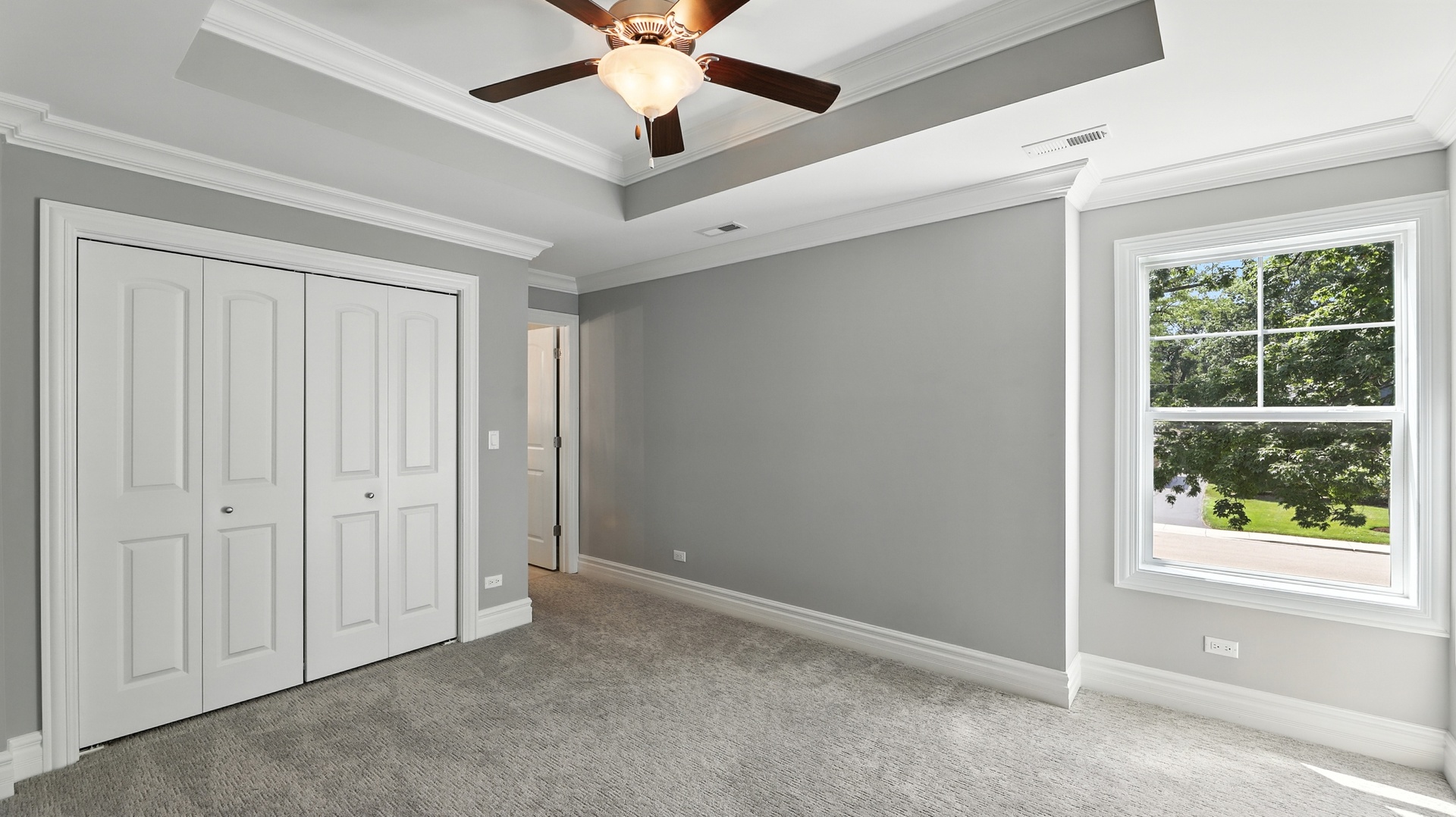 1127 Kenton Road Deerfield, IL 60015 - Photo 19 of 35 an empty room with windows and fan