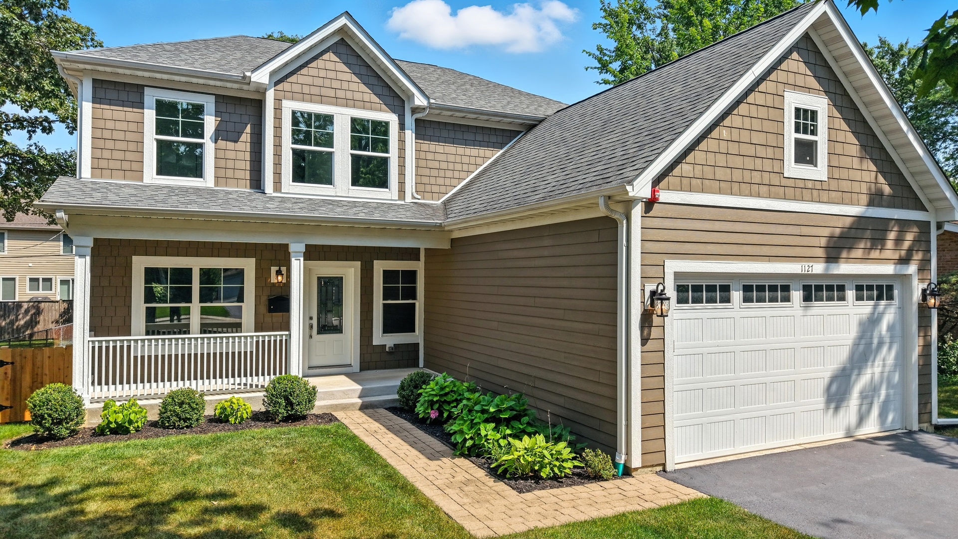 1127 Kenton Road Deerfield, IL 60015 - Photo 2 of 35 a view of a house with a yard and plants