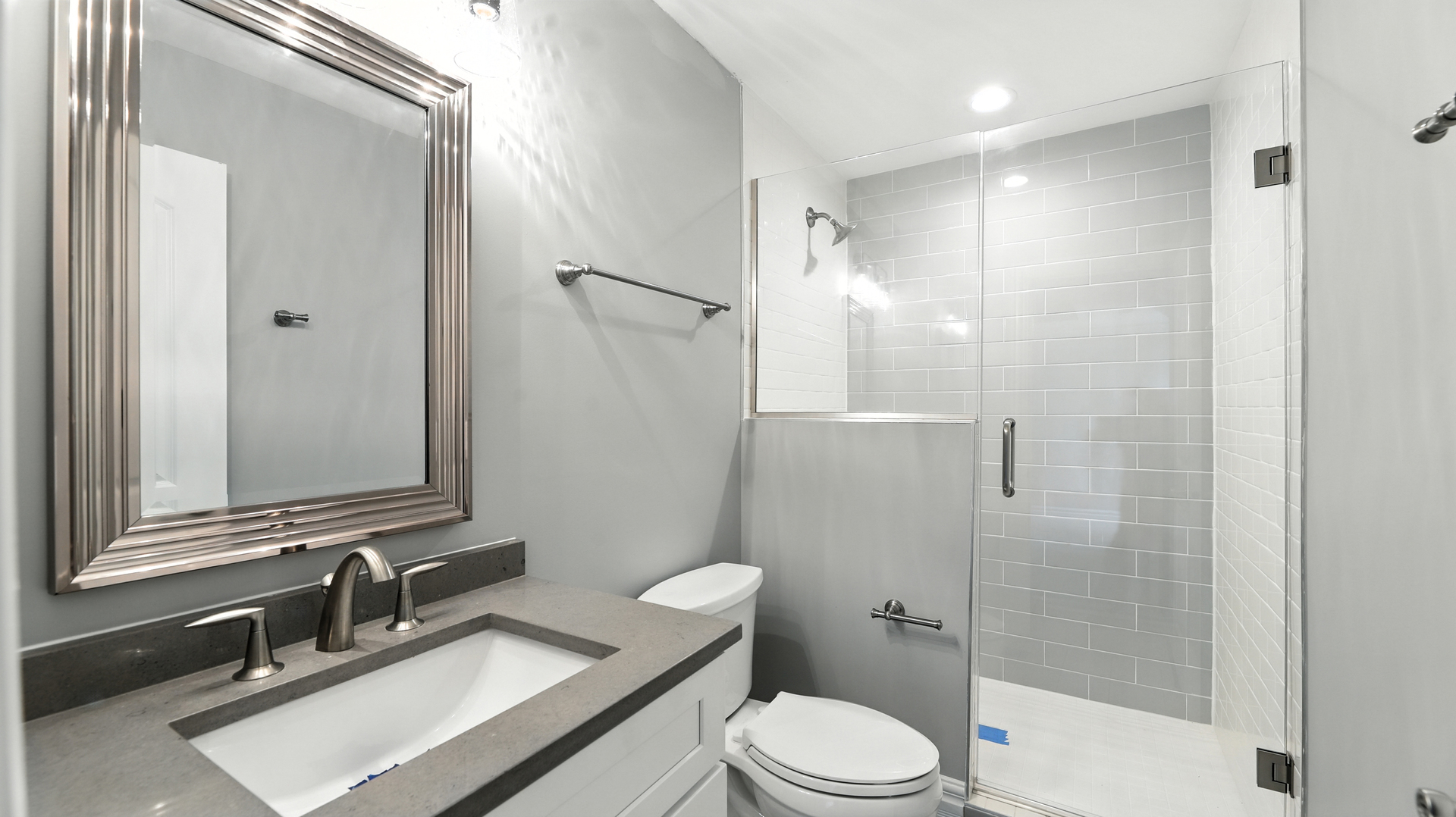 1127 Kenton Road Deerfield, IL 60015 - Photo 21 of 35 a bathroom with a sink a toilet and shower