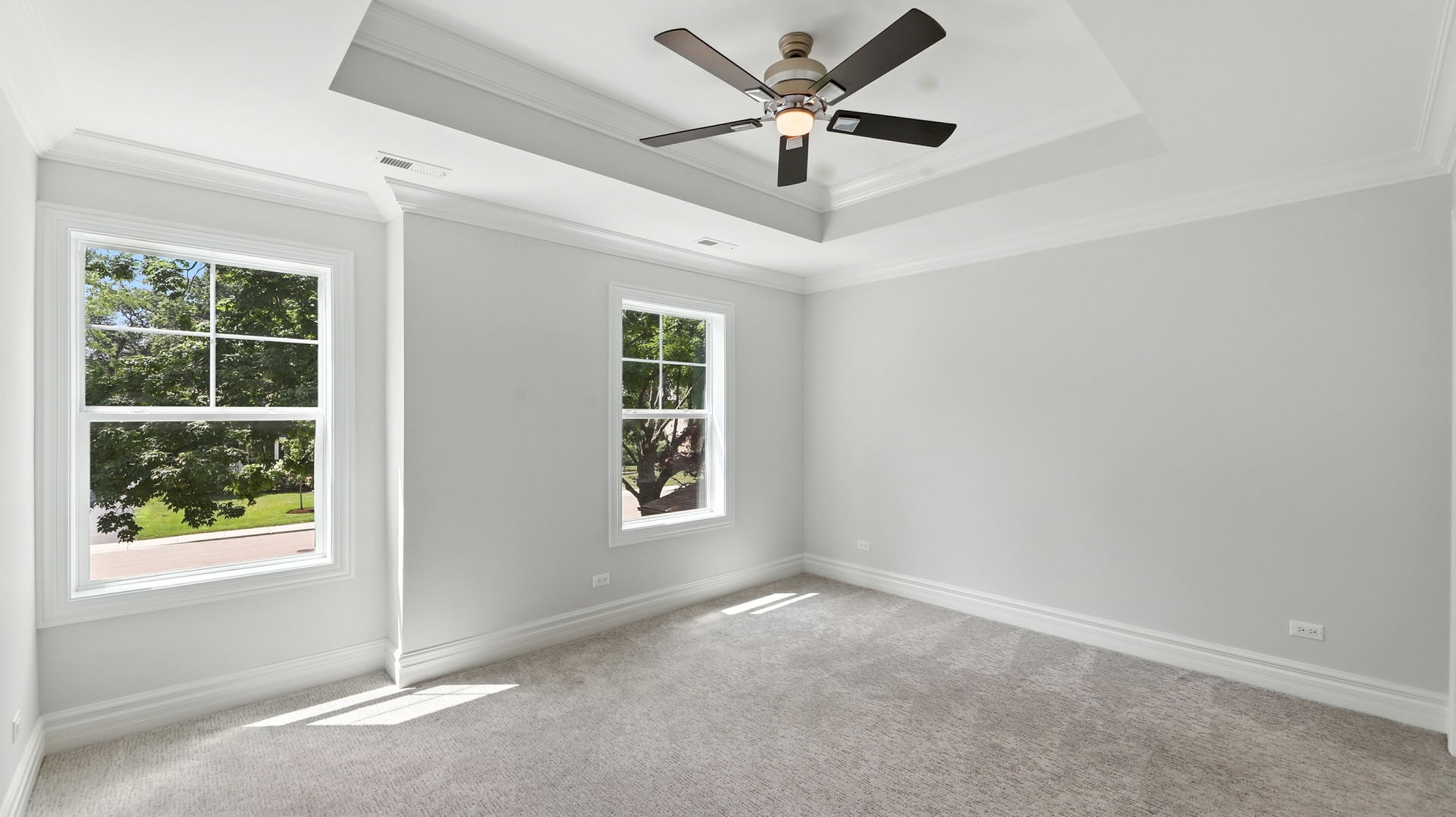 1127 Kenton Road Deerfield, IL 60015 - Photo 22 of 35 an empty room with a window and a fan