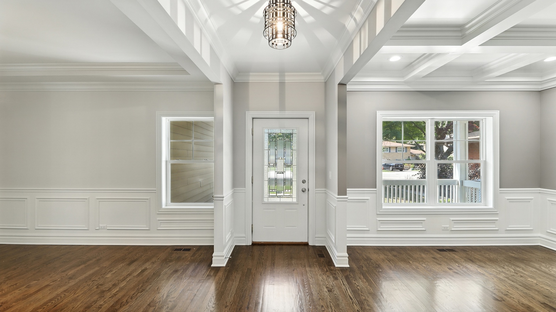 1127 Kenton Road Deerfield, IL 60015 - Photo 3 of 35 an empty room with wooden floor and windows