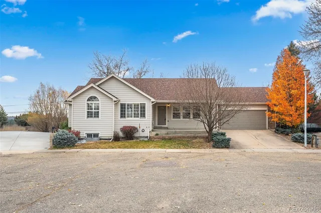 a view of large house with a yard