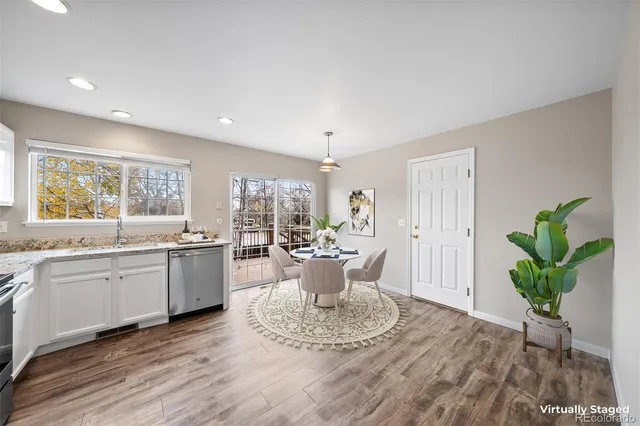 a view of a living room and kitchen with a large window
