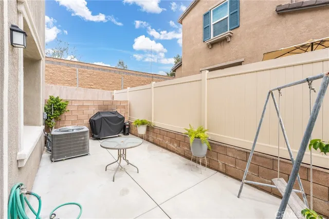 a view of a chairs and table in the patio