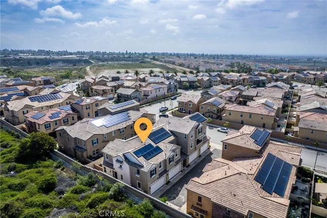 an aerial view of a house with a swimming pool