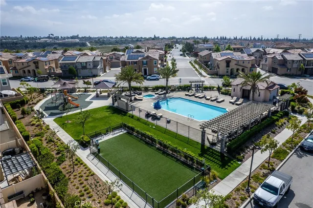 an aerial view of a resort with swimming pool and ocean view