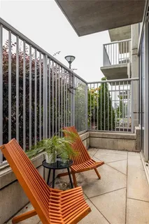 a view of a chairs and table in the patio