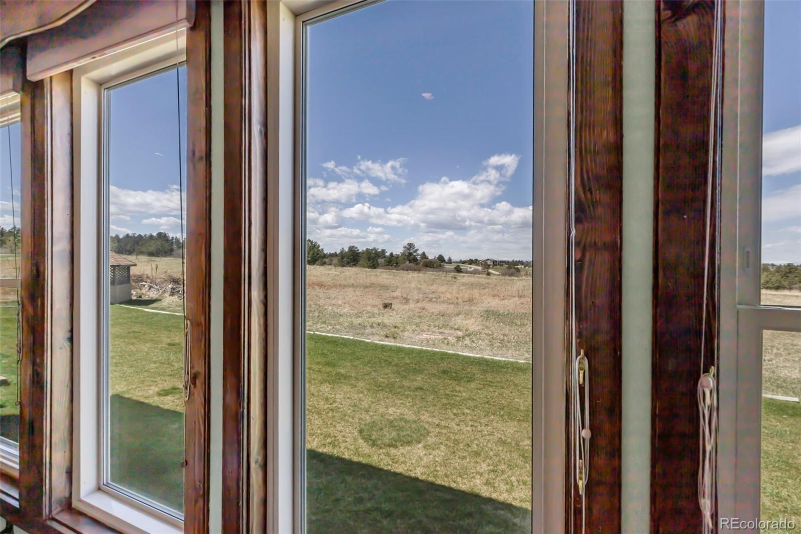 1493 Flintwood Road Franktown, CO 80116 - Photo 24 of 31 a view of sky from window