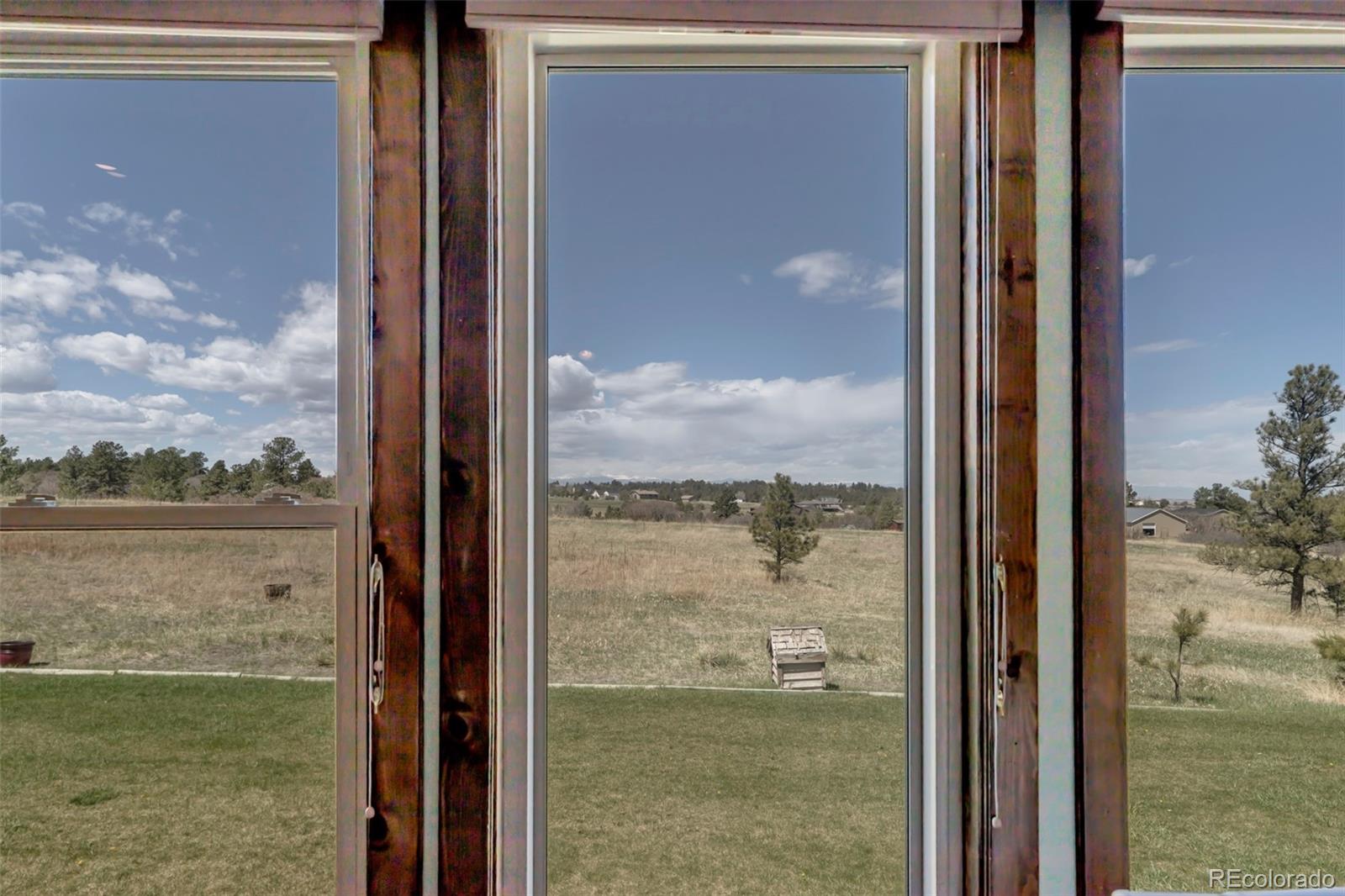 1493 Flintwood Road Franktown, CO 80116 - Photo 25 of 31 a view of a balcony