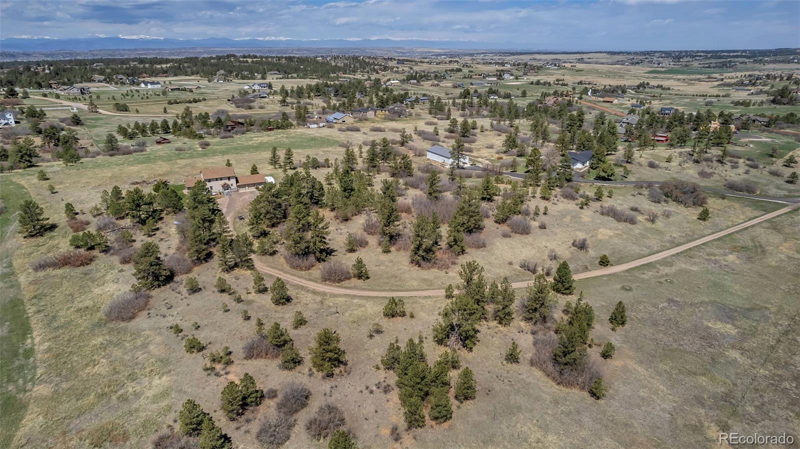 1493 Flintwood Road Franktown, CO 80116 - Photo 5 of 31 a view of a field with wooden fence