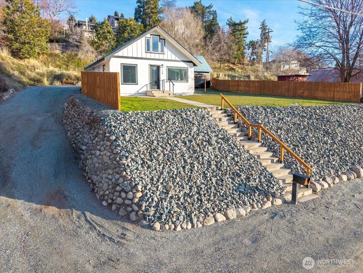 124 Boetzke Avenue Manson, WA 98831 - Photo 1 of 36 a front view of a house with a yard