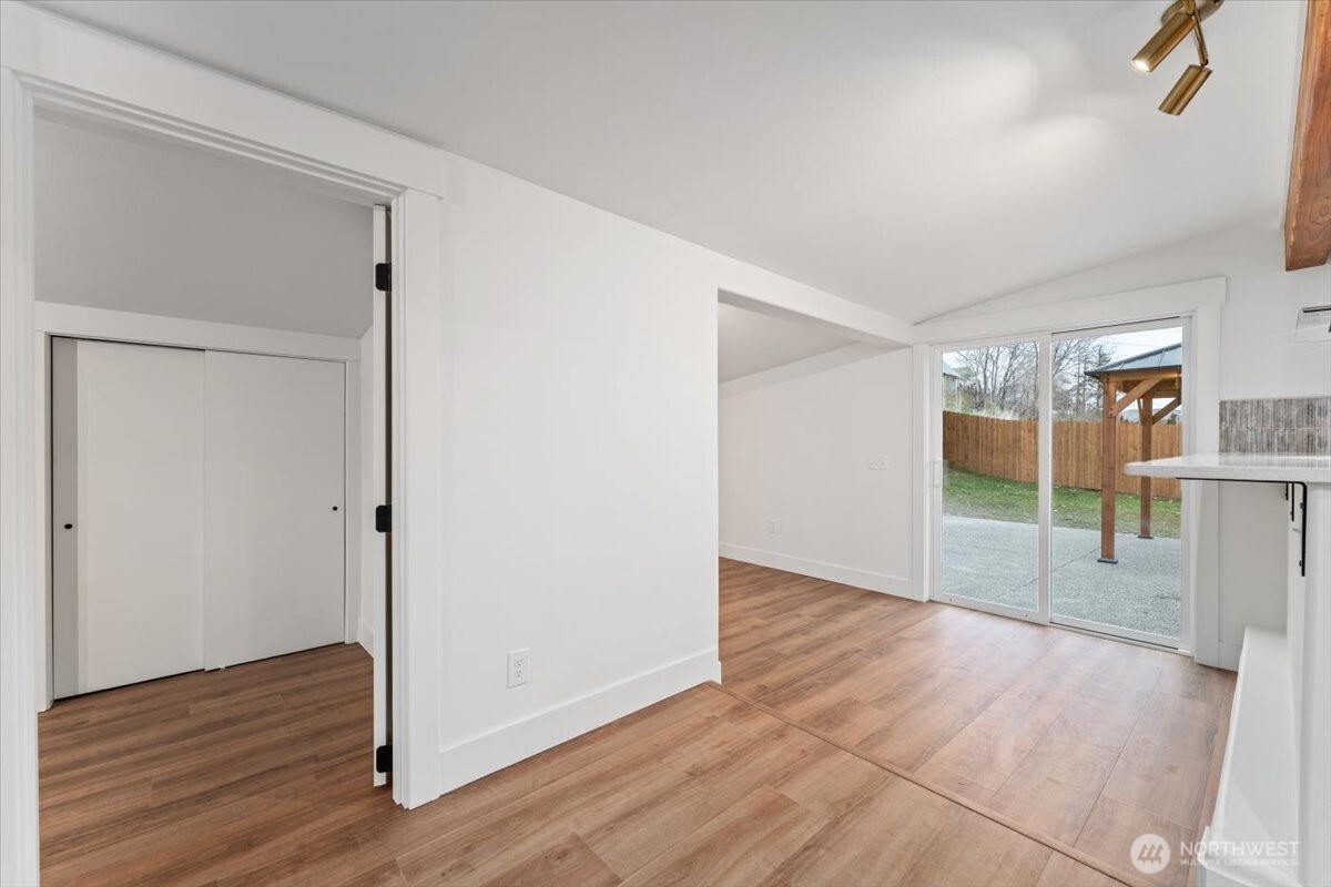 124 Boetzke Avenue Manson, WA 98831 - Photo 20 of 36 a view of an empty room with wooden floor