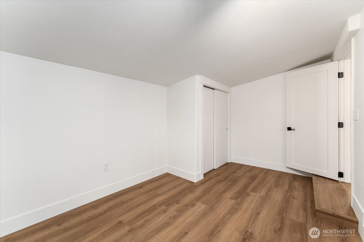 124 Boetzke Avenue Manson, WA 98831 - Photo 22 of 36 a view of empty room with wooden floor
