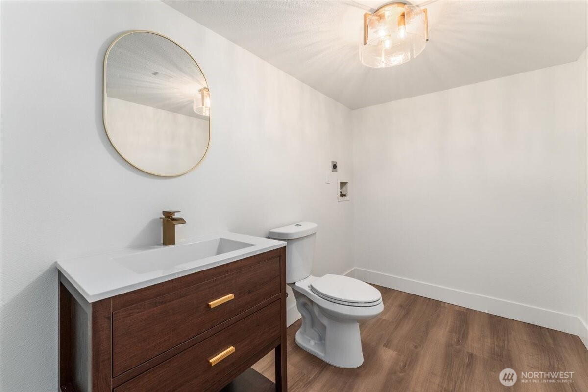 124 Boetzke Avenue Manson, WA 98831 - Photo 23 of 36 a bathroom with a toilet a sink and mirror