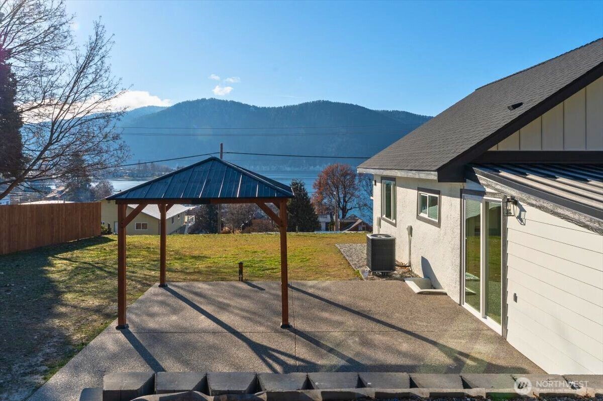 124 Boetzke Avenue Manson, WA 98831 - Photo 31 of 36 a view of a house with backyard and sitting area