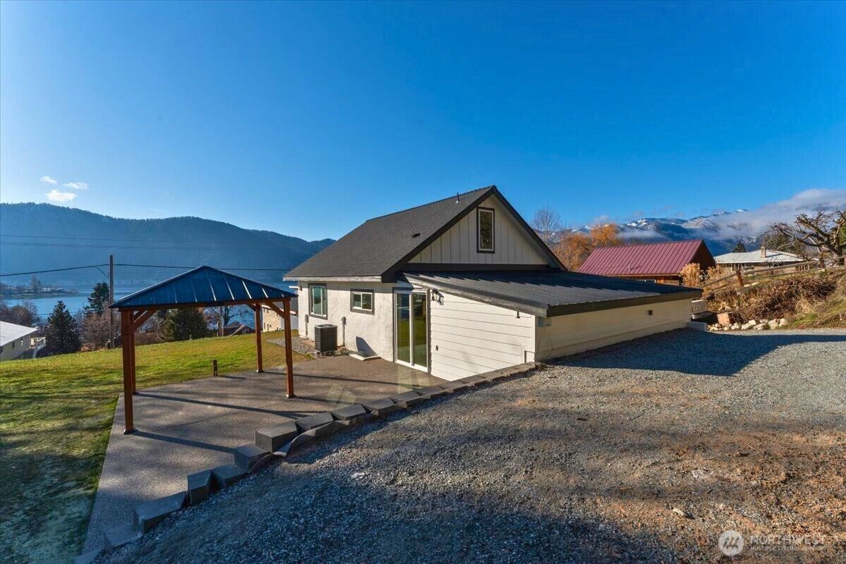 124 Boetzke Avenue Manson, WA 98831 - Photo 32 of 36 a front view of a house with a yard
