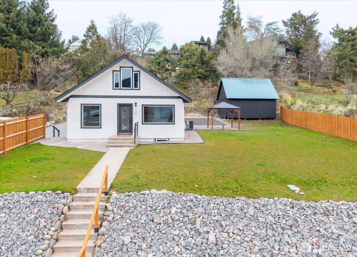 124 Boetzke Avenue Manson, WA 98831 - Photo 33 of 36 a front view of a house with garden