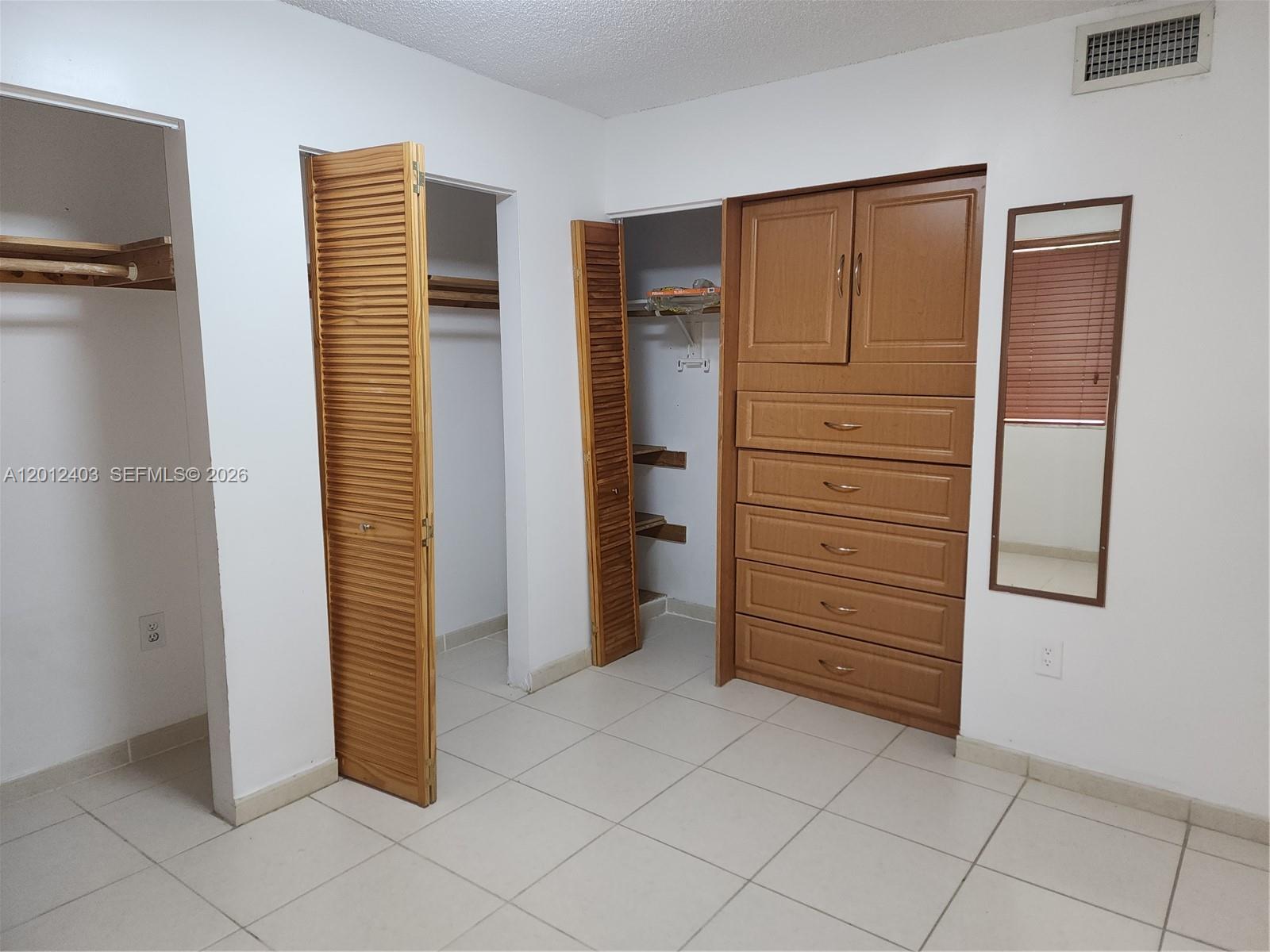 8990 Southwest 24th Street, Unit 19 Miami, FL 33165 - Photo 11 of 16 a view of walk in closet