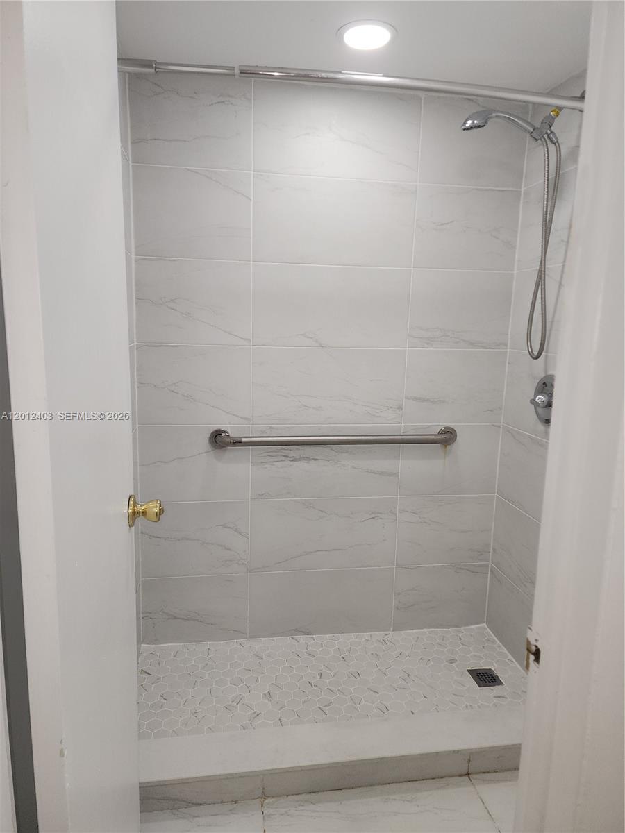 8990 Southwest 24th Street, Unit 19 Miami, FL 33165 - Photo 9 of 16 a bathroom with a shower