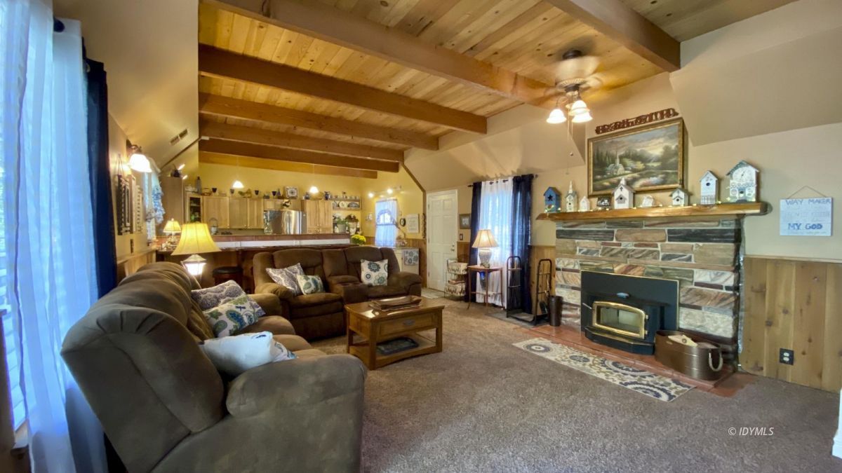 52905 Tollgate Road Idyllwild, CA 92549 - Photo 5 of 91 a living room with furniture and a fireplace