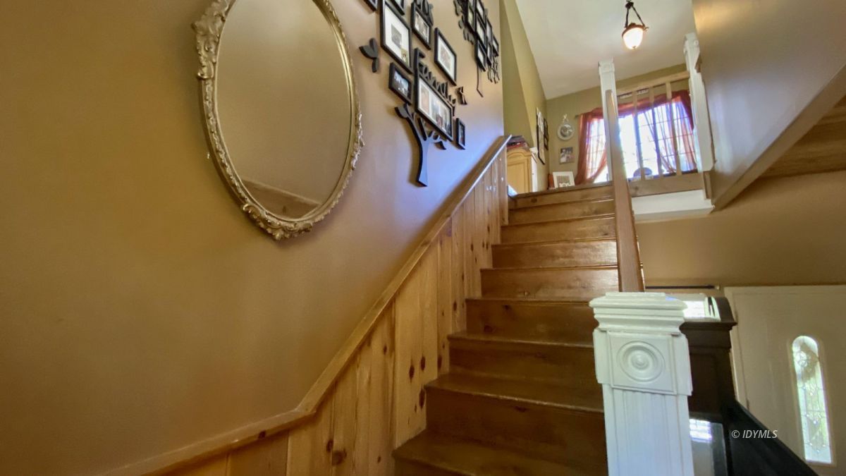 52905 Tollgate Road Idyllwild, CA 92549 - Photo 64 of 91 a view of staircase with railing and a chandelier