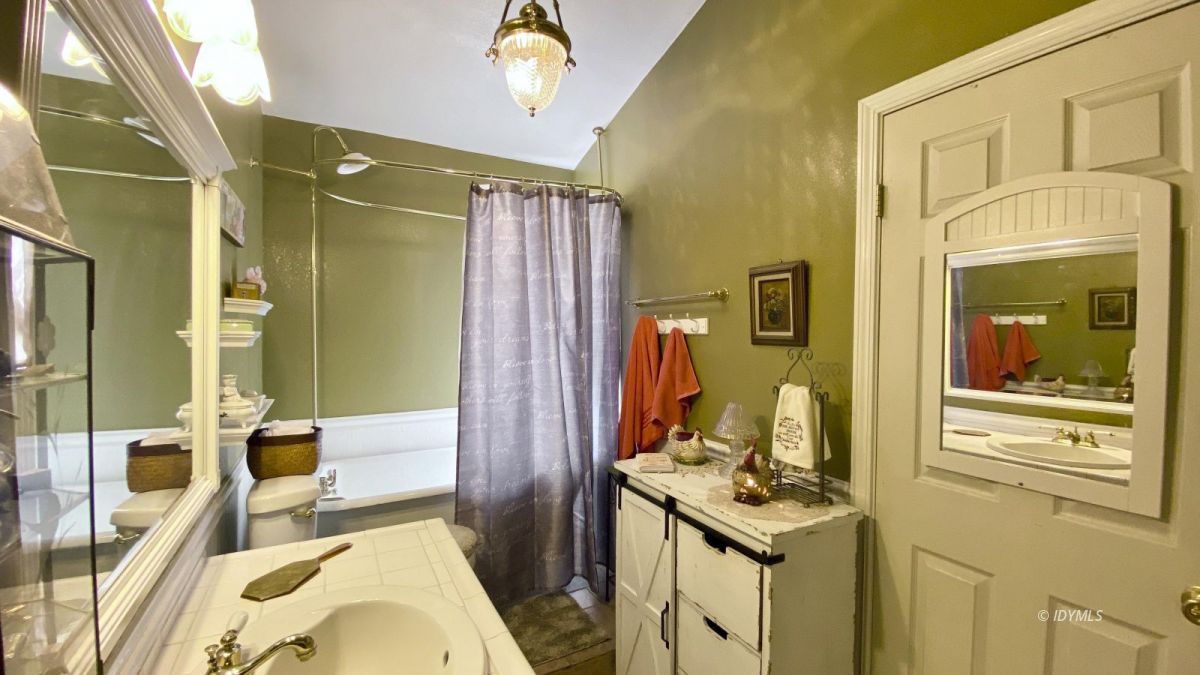 52905 Tollgate Road Idyllwild, CA 92549 - Photo 82 of 91 a bathroom with a granite countertop sink a mirror and shower