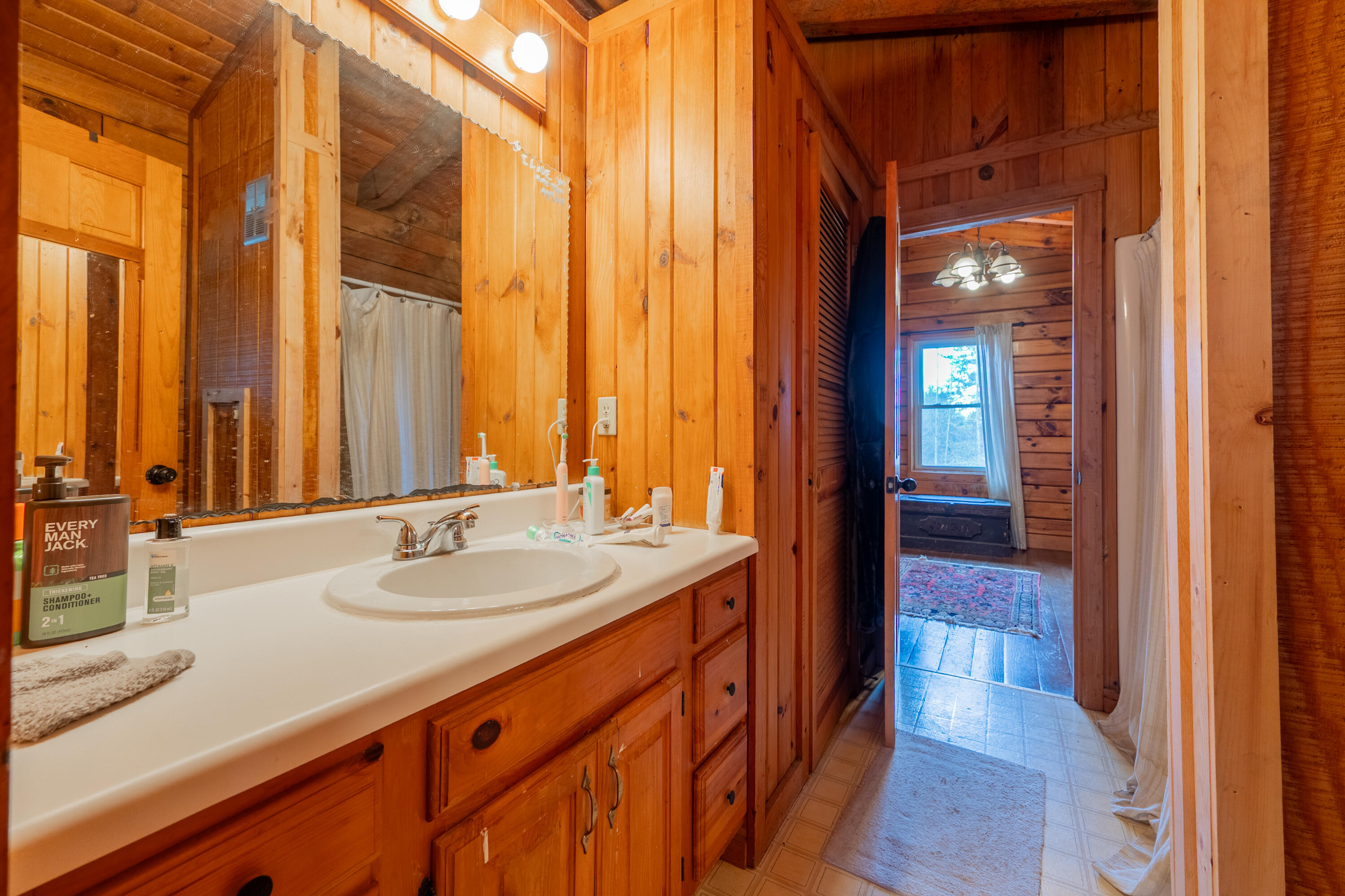 183 Pine Mountain Road Northeast Floyd, VA 24091 - Photo 22 of 54 a bathroom with a sink and a mirror