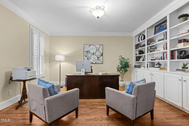 a view of an entryway with wooden floor and door