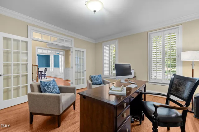 a view of a dining room with furniture and window