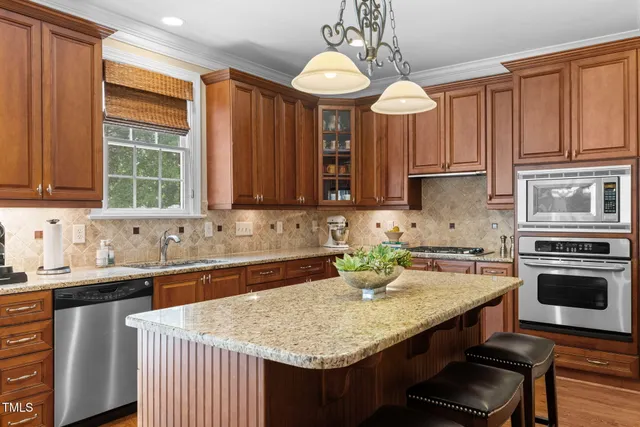 a view of a chair and fire pit in the backyard