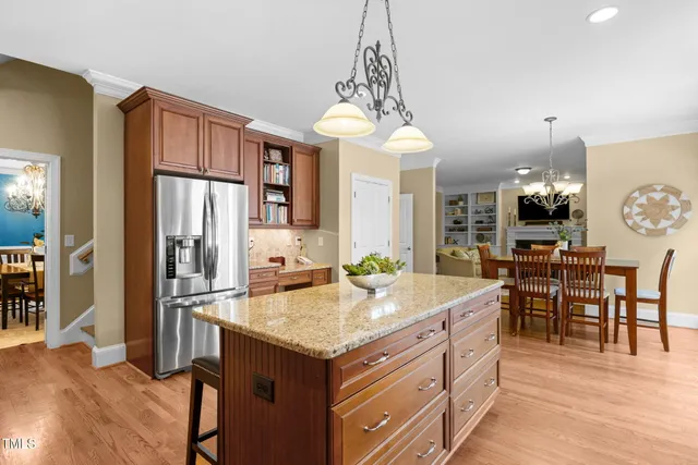 a kitchen with lots of counter space dining table and chairs