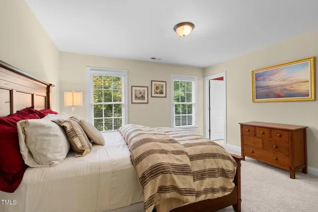 a bedroom with furniture and a window