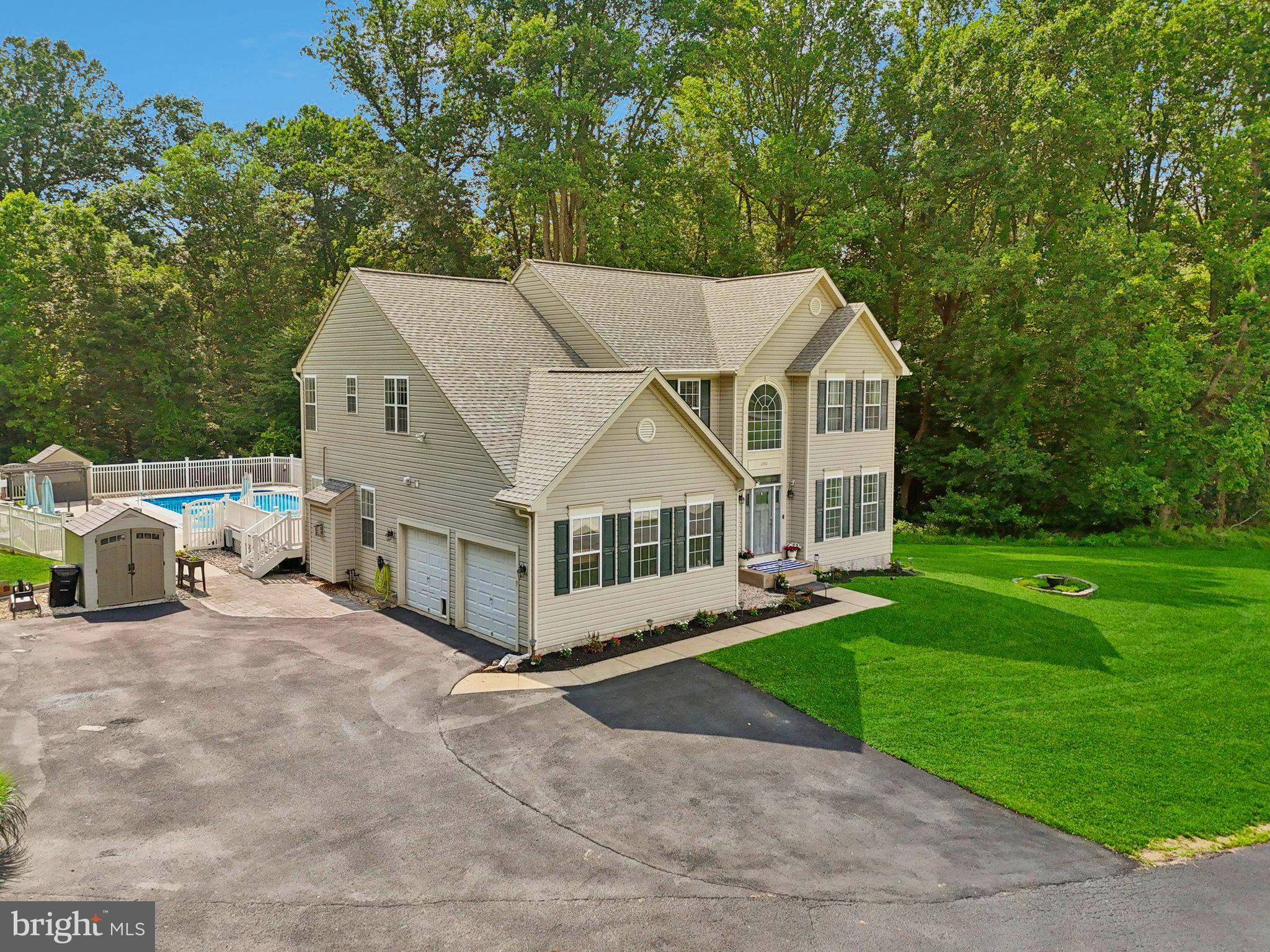 2742 Ridge Road Windsor Mill, MD 21244 - Photo 54 of 70 a view of a big house with a big yard and large trees
