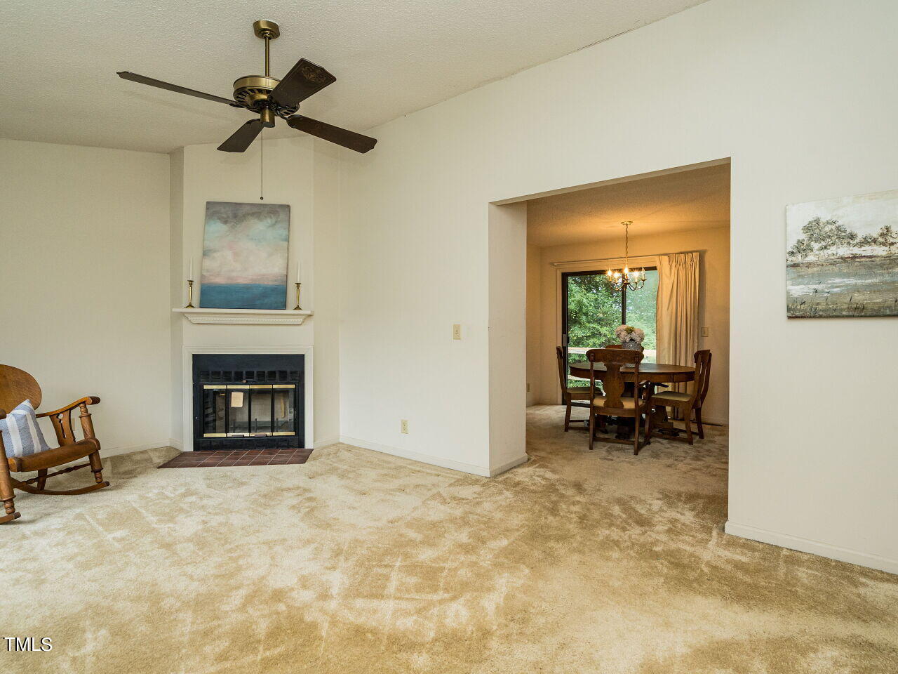 6804 Ray Road Raleigh, NC 27612 - Photo 3 of 24 a view of livingroom with a fireplace and workspace