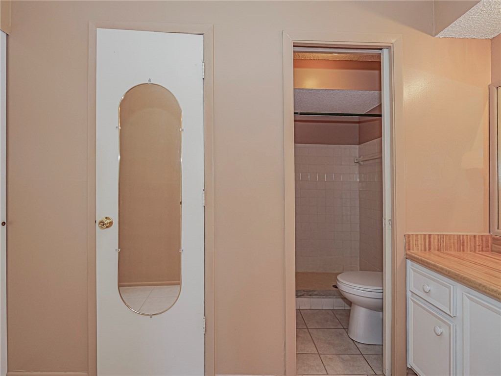 6006 Indrio Road, Unit B4 Fort Pierce, FL 34951 - Photo 19 of 36 a bathroom with a toilet and a sink