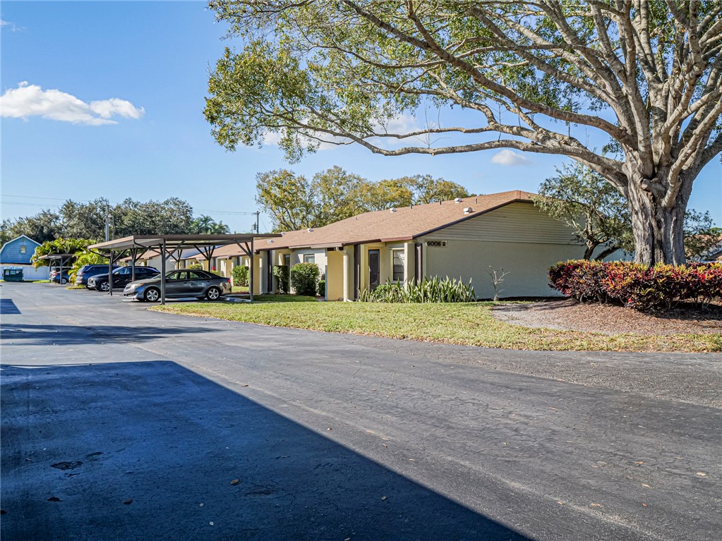 6006 Indrio Road, Unit B4 Fort Pierce, FL 34951 - Photo 2 of 36 a view of multiple houses with a street