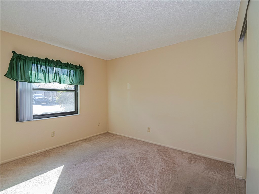 6006 Indrio Road, Unit B4 Fort Pierce, FL 34951 - Photo 22 of 36 a view of an empty room with a window