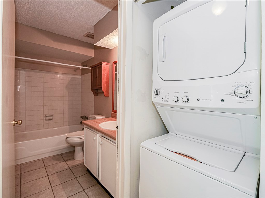 6006 Indrio Road, Unit B4 Fort Pierce, FL 34951 - Photo 25 of 36 a view of bathroom with a bath tub and toilet